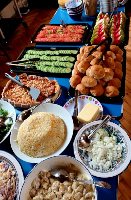 Parish Lunch table laden with plates of food